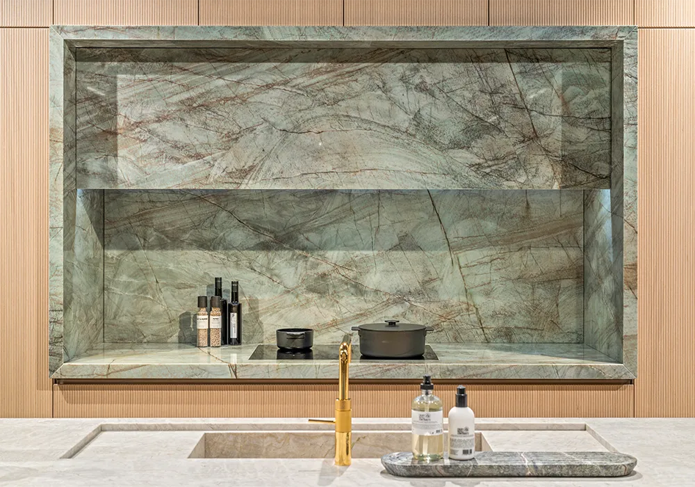 i-luminate premium kitchen with a quartzite niche embedded in the light oak wood fronts.